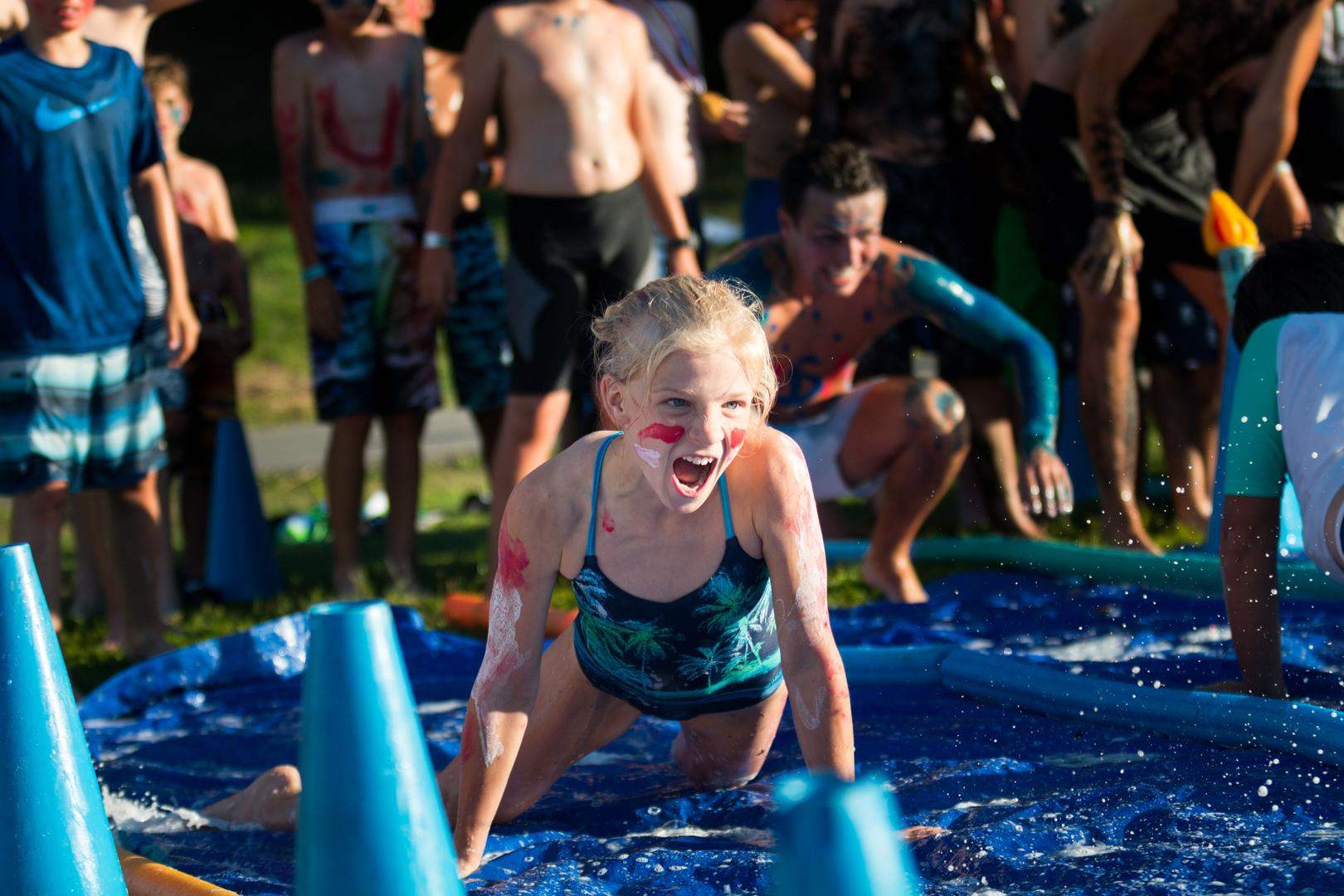 A young girl with faceprint on a waterslide